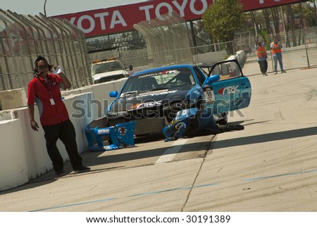 LONG BEACH, CA - APRIL 11: Casper Canul figuring out what was wrong with his car during 2009 Formula Drift April 11, 2009 in Long Beach.