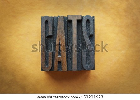The word CATS written in vintage letterpress type.