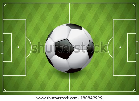 A realistic football / soccer ball on a textured grass playing field. Vector EPS 10. File contains transparencies and gradient mesh.