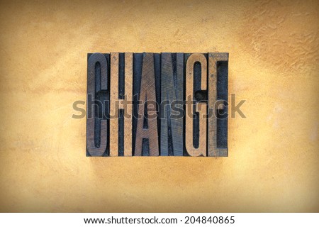 The word CHANGE written in vintage letterpress type