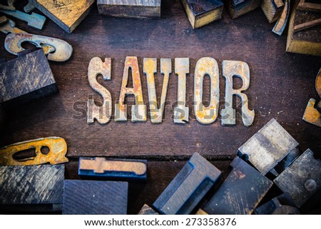 The word SAVIOR written in rusted metal letters surrounded by vintage wooden and metal letterpress type.