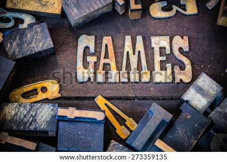 The word GAMES written in rusted metal letters surrounded by vintage wooden and metal letterpress type.
