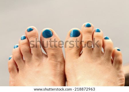 feet girl and blue toenails