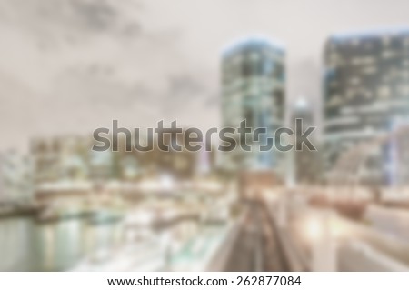 Skyscrapers near the water. Designed to work with most overlay text colors including white. Artistic intent with filters and desaturation. Nighttime.