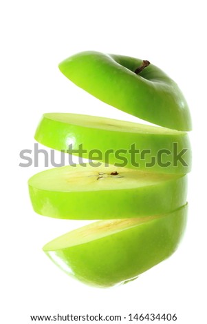 Green apple sliced into four pieces