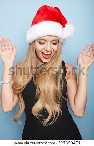 Portrait of a beautiful woman with a santa hat.
