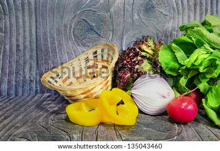 Vegetables on wood table with basket