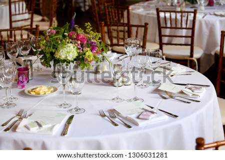 flower arangement at a wedding event - Bouquet of flowers on a table set for fine dining during a wedding