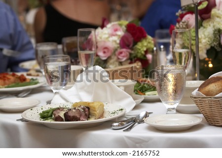 stock photo wedding food on a table with a bouquet of flowers in the 