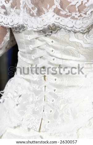 laces on the back of a white wedding dress