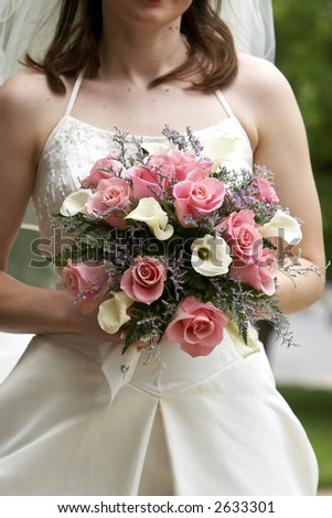 Pretty bridal wedding bouquet being held by a bride