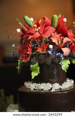 A cake from a wedding with candy flowers and rock sugar- please see my portfolio for many more wonderful and tasty cakes