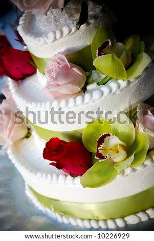 a fancy wedding cake decorated with flowers