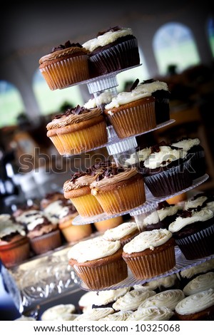 a bunch of wedding cupcakes. Many people choose cupcakes over the traditional cake