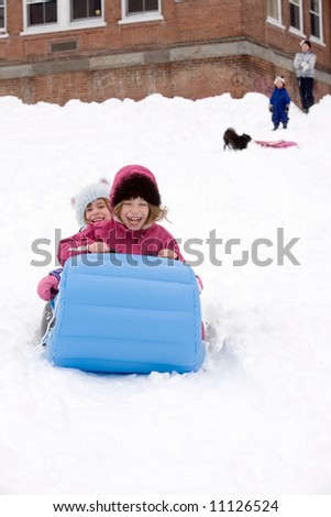 Pictures Of Kids Sledding. of kids sledding on a cold