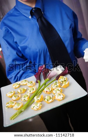 wedding or event food being served by the wait staff
