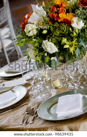 details from a wedding. Table set for fine dining with a pretty bouquet