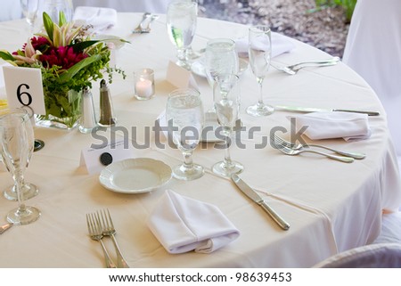 A wedding table set for fine dining during a catered event