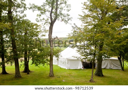 A tent set up for an outside wedding reception or other function