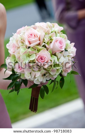 bridal wedding bouquet of flowers in white, pink, and green
