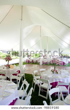 stock photo Inside a large wedding tent set up for an outdoor reception