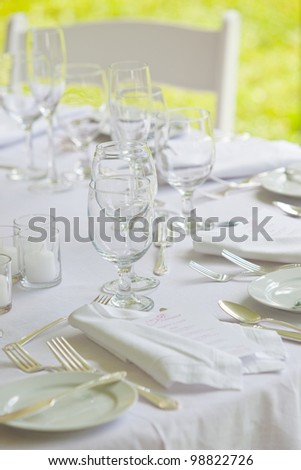 A wedding table set up for fine dining in all white
