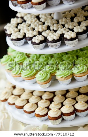mini cupcakes on a multi level tier in different colors