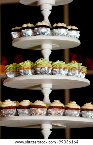 mini cupcakes on a multi level tier in different colors