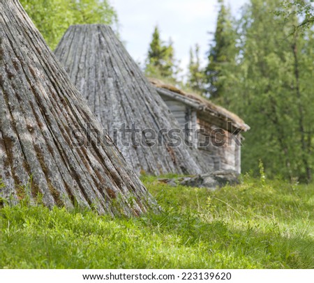 Close up on a wooden tepee, warehouse building in the Nordic taiga mountains. Elderly wooden buildings in a landmark, memorial in the Nordic mountain and countryside .