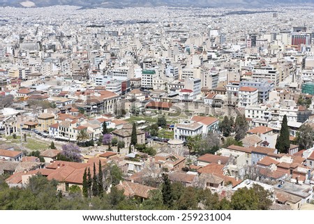 ATHENS, GREECE ON APRIL 14. Skyline of the City of Athens from a hill, slope on April 14, 2011 in Athens, Greece. Large number of white buildings. Roman Agora this side.