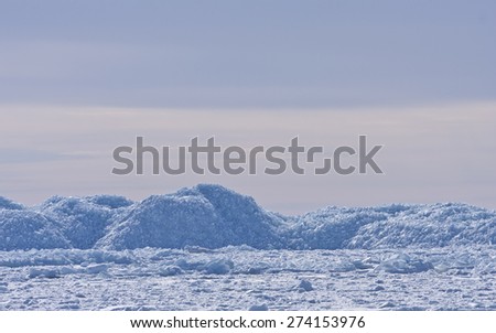 Coast, coastline and shore of the Baltic Sea in March during the day, hours when the ice at sea breaks up. Barriers of ice.