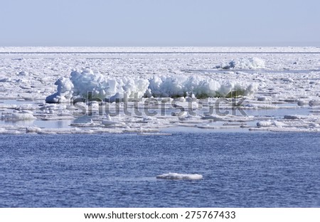 Blocks of ice and snow on The Baltic Sea in March during the day, hours when the ice at sea breaks up.