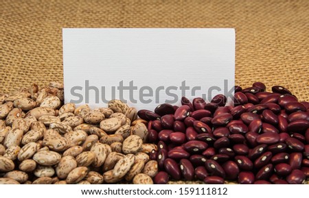 pinto and red beans on burlap with note card