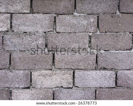 Grey cement blocks wall surface, useful as background