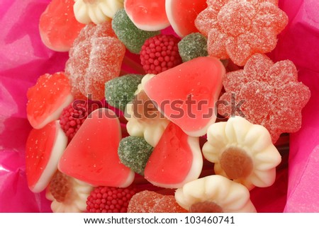 background of candy bouquet in shiny pink wrapping