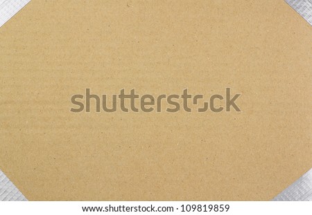background of brown cardboard with duct taped edges with room for text or label (copy space)