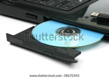 open tray of a laptop dvd writer with dvd on a white background