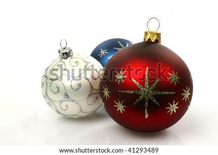 Red, blue and silver christmas balls on a white background