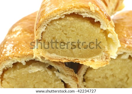 pastry rolls with almond paste on a white background