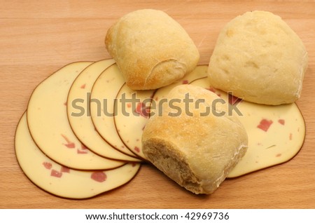 fresh bread with slices of smoked cheese