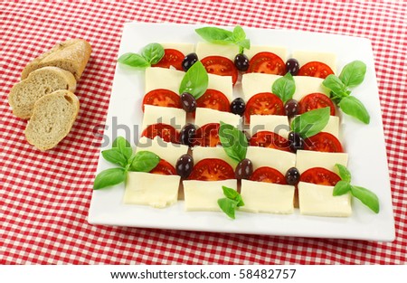 delicious mozzarella and tomato salad (caprese salad) with French bread