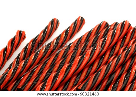 red and black licorice candy on a white background