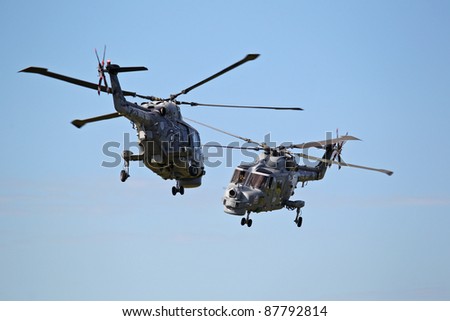 LEEUWARDEN,FRIESLAND,HOLLAND-SEPTEMBER 17: Royal Navy Helicopter Display Team \'Black Cats\'  at the at the“Luchtmachtdagen” Airshow on September 17, 2011 at Leeuwarden Airfield,Friesland,Holland