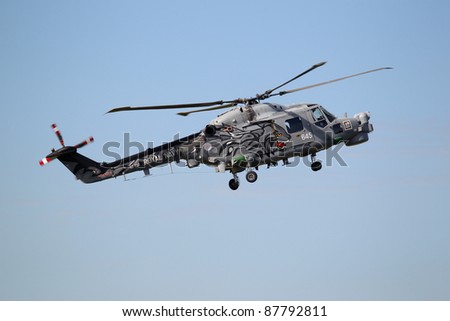 LEEUWARDEN,FRIESLAND,HOLLAND-SEPTEMBER 17: Royal Navy Helicopter Display Team \'Black Cats\'  at the at the“Luchtmachtdagen” Airshow on September 17, 2011 at Leeuwarden Airfield,Friesland,Holland