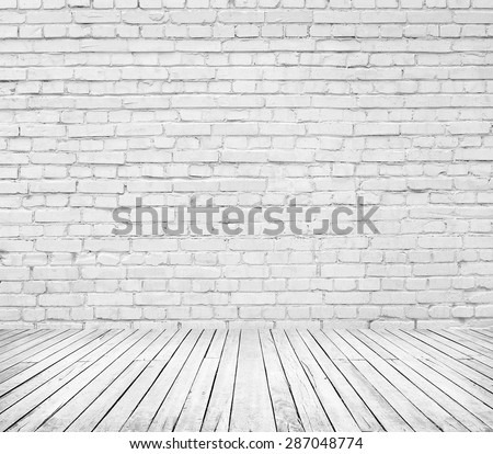 White room interior with brick wall and wooden floor