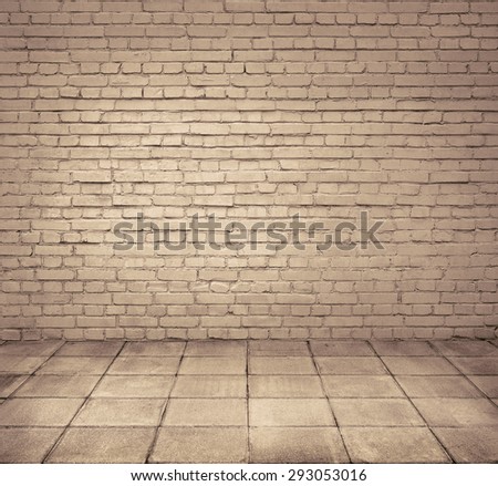 Grunge room interior with brick wall and tiled floor