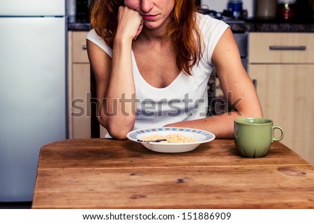Young woman hates cereal