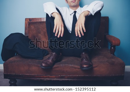 Businessman relaxing after long day at work