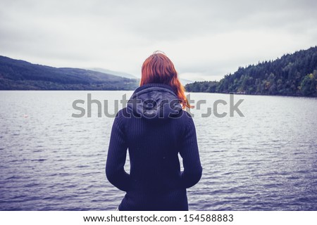 Woman Admiring Stillness Of The Lake