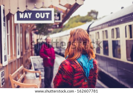 Young Woman At Train Station